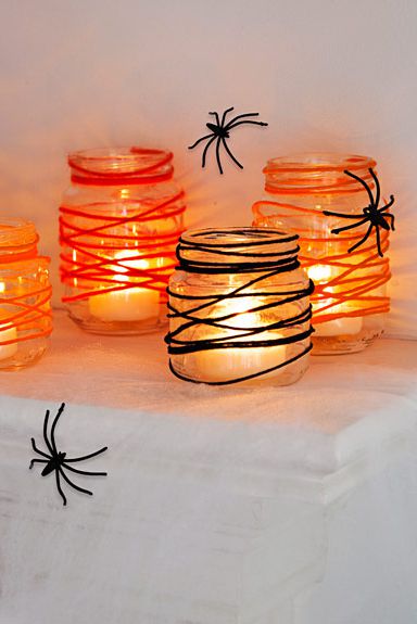 Tangled web mason jar. Find 20 more best Halloween party decoration ideas. Halloween party ideas. Mason jar ideas. 