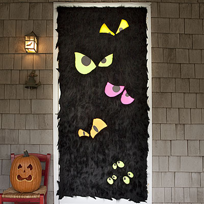 Frankenstein Halloween Door Decoration ideas. Find more spooky Halloween door decorating ideas. Front door decorations. 