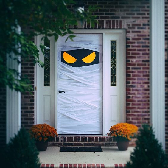 This Halloween, try some spooky door decorations. Find more haunted and funny Halloween door decorating ideas. Front door decorations. 